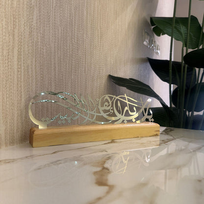 Decorative item with a wooden base on a marble surface